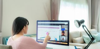 woman sitting in front of a computer working from home.