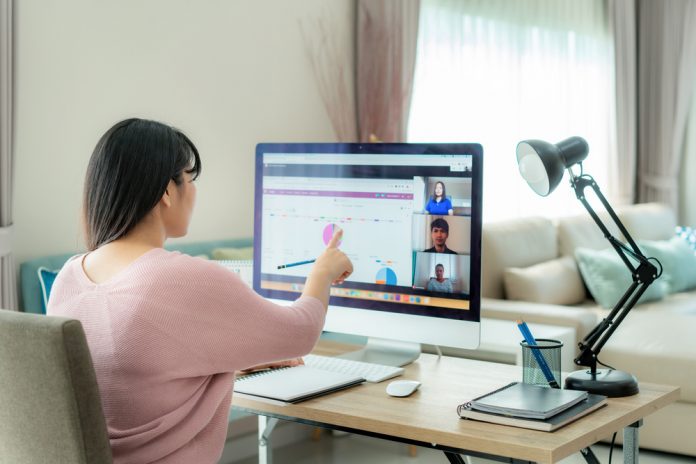 woman sitting in front of a computer working from home.