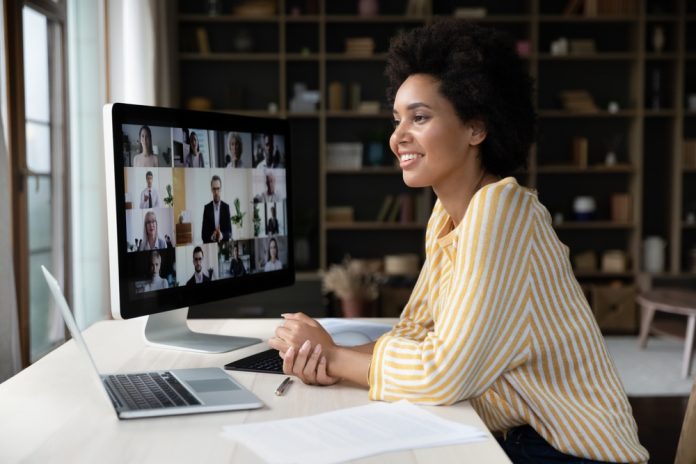 Remote employee engaging with other coworkers online.