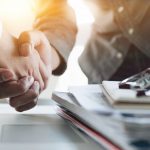 two business partners shaking hands