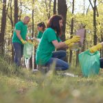 Volunteers,In,Green,T-shirts,Clean,Up,The,Plastic,Trash,In