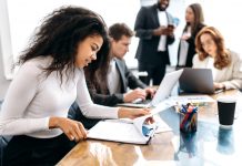 Extended Enterprise: Why Learning Isn’t Just for Employees Concentrated,African,American,Woman,Doing,Paperwork,,Sitting,In,Modern,Office