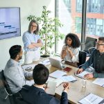 Senior,Female,Ceo,And,Multicultural,Business,People,Discussing,Company,Presentation