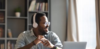 Happy,Relaxed,Millennial,Afro,American,Business,Man,Wear,Wireless,Headphones