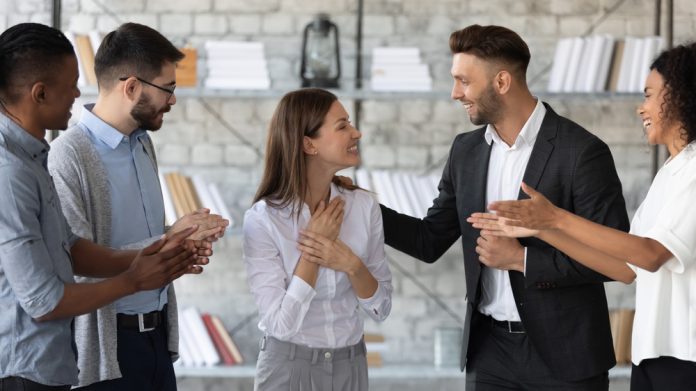 Smiling,Supportive,Diverse,Businesspeople,Congratulate,Excited,Young,Caucasian,Female,Employee