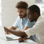 Multiracial,Team,Working,Together,In,Office,Teamwork,On,Laptop,Analyzing