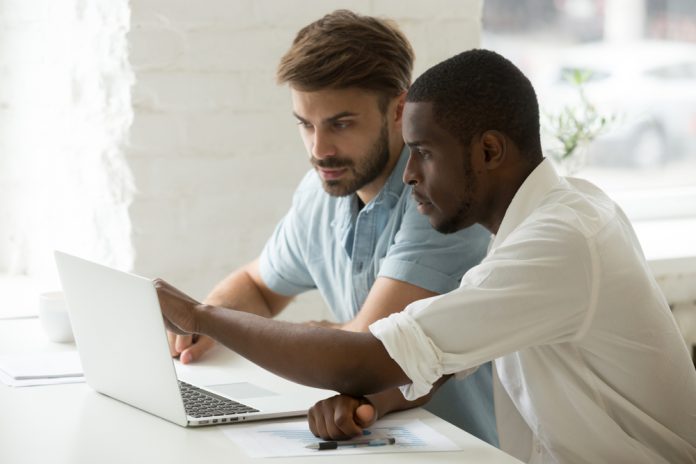 Multiracial,Team,Working,Together,In,Office,Teamwork,On,Laptop,Analyzing