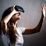 Young,Woman,Using,A,Virtual,Reality,Headset