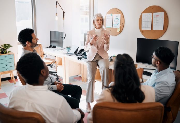 Business,,Mature,Manager,Or,Training,Team,In,Office,On,Risk