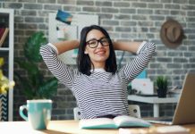 Woman sitting back in a desk chair