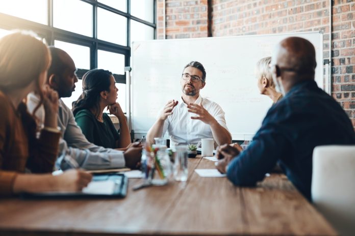 Man,,Manager,And,Meeting,Or,Presentation,In,Boardroom,With,Coworkers