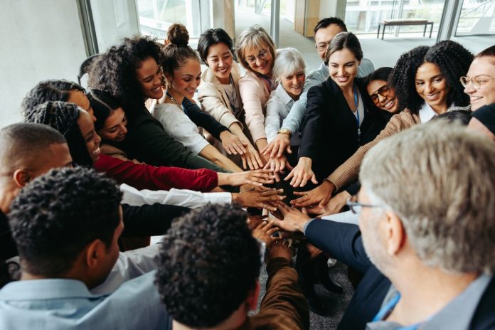Diverse,Team,Demonstrating,Teamwork,And,Inclusion,At,A,Conference,,Focusing