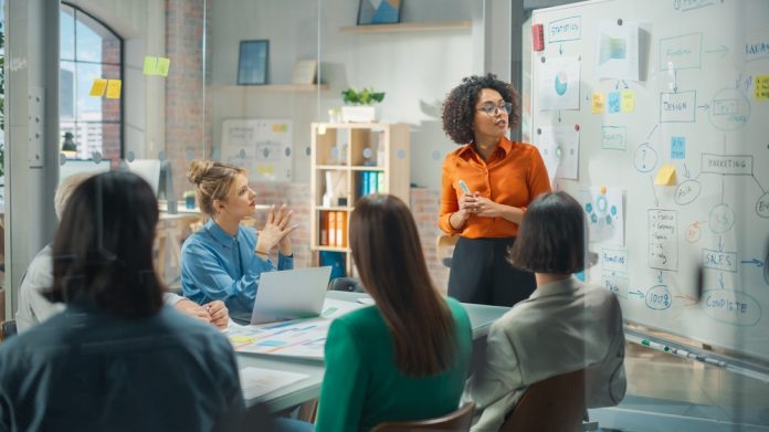 Beautiful,Black,Businesswoman,Gives,Report,,Presentation,To,Her,Business,Colleagues