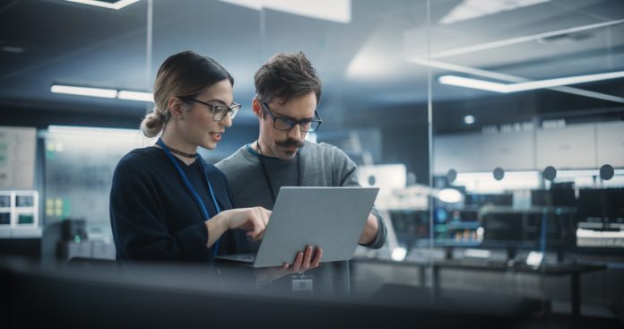 Portrait,Of,Two,Creative,Young,Female,And,Male,Engineers,Using