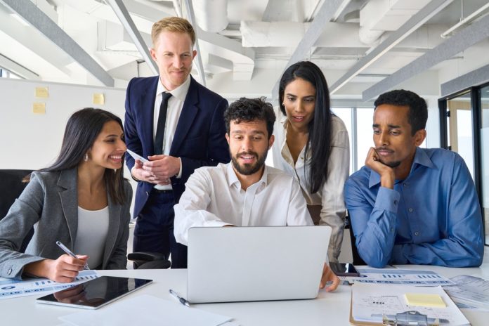 Busy,Diverse,Professional,Business,People,Executives,Looking,At,Laptop,In