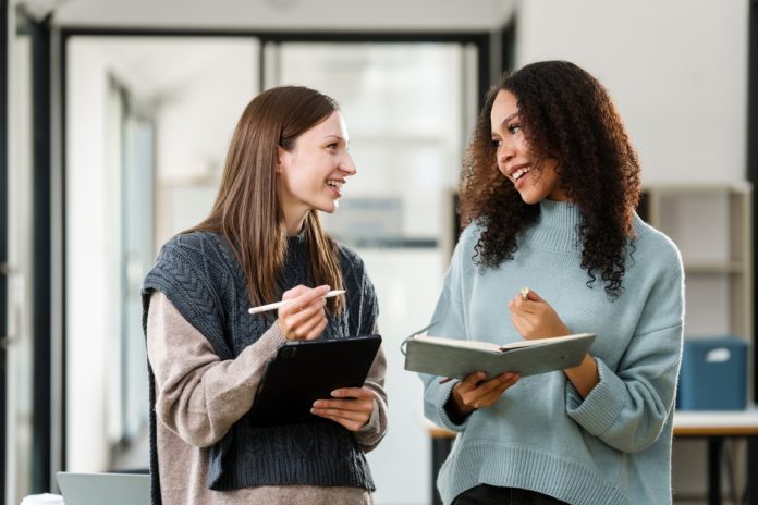 Caucasian,And,An,African,American,University,Woman,Working,Together,On