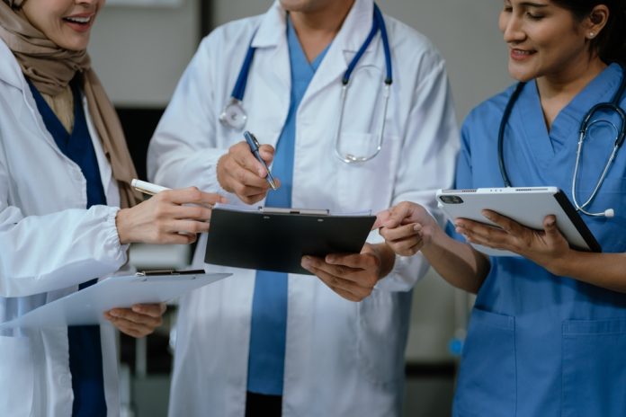 Medical,,Meeting,And,Laptop,For,Team,In,Office,In,Discussion,