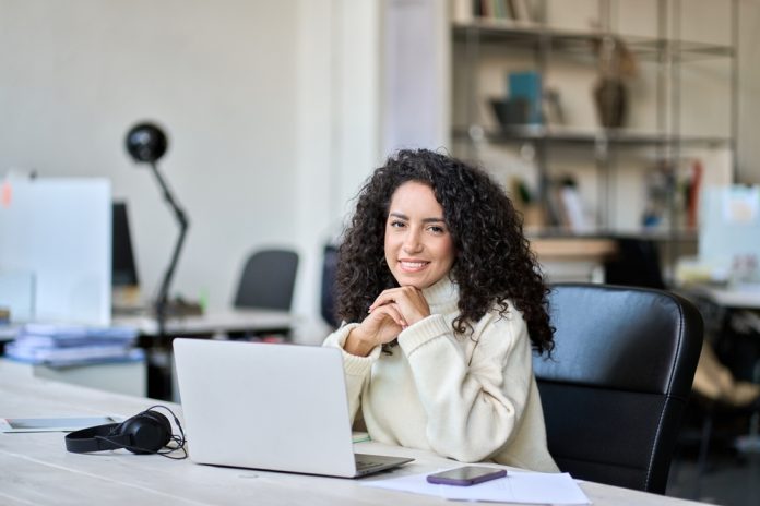 Young,Happy,Latin,Business,Woman,Company,Worker,Sitting,At,Desk