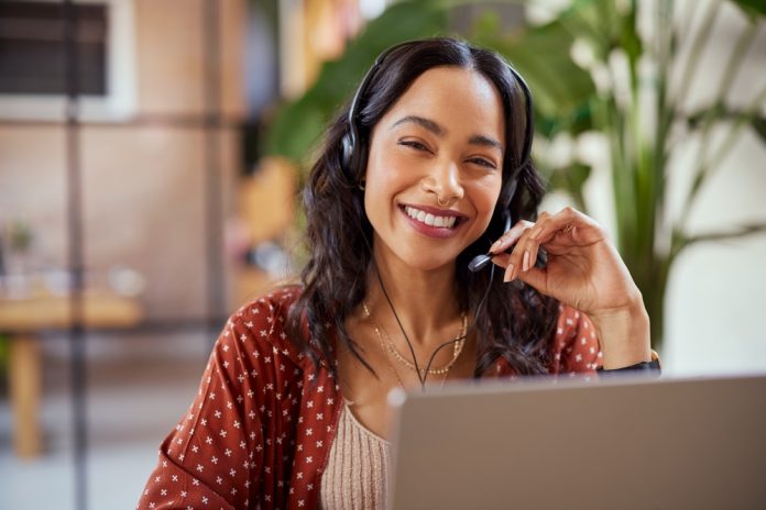 Smiling,Businesswoman,Working,In,A,Creative,Office.,Smiling,Friendly,Woman