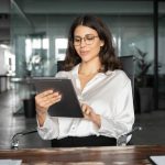 Responding to the Accelerating Innovation Vortex a woman at work looking at an Ipad