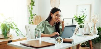 a woman looking at her computer