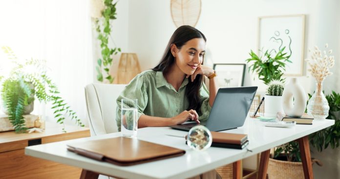 a woman looking at her computer