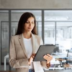 a woman working on a computer.