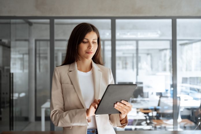 a woman working on a computer.