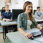 How to Run Technology Training for Non-Technical Staff a woman taking a course online