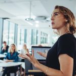 Businesswoman,Delivering,A,Presentation,At,A,Conference.,Female,Entrepreneur,Sharing