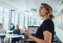 Businesswoman,Delivering,A,Presentation,At,A,Conference.,Female,Entrepreneur,Sharing