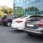 Cars,Parked,In,Parking,Lot,Near,Business,Center,In,City