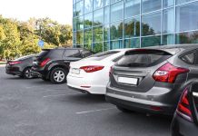 Cars,Parked,In,Parking,Lot,Near,Business,Center,In,City