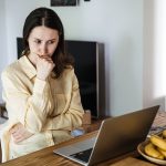 Why Colleges Need a New Playbook for Career Capital Young,Asian,Woman,Looking,Frustrated,At,A,Laptop,While,Holding