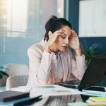 Woman,,Headache,And,Laptop,With,Documents,,Stress,And,Charts,At
