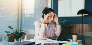 Woman,,Headache,And,Laptop,With,Documents,,Stress,And,Charts,At