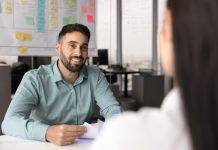 Recruiter,Holding,Resume,And,Listening,Female,,Vacancy,Candidature,Seated,At