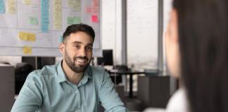 Recruiter,Holding,Resume,And,Listening,Female,,Vacancy,Candidature,Seated,At