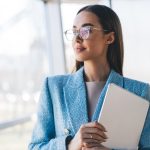 The Secrets of Visionary Leaders: Who Think Possibility Before Productivity Confident,Freelancer,Holding,Tablet,Near,Window,,Gazing,Thoughtfully,Outside,,Symbolizing