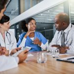 Making a diagnosis as a unit. a group of doctors having a meeting in a hospital.