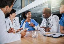 Making a diagnosis as a unit. a group of doctors having a meeting in a hospital.