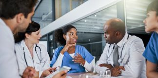 Making a diagnosis as a unit. a group of doctors having a meeting in a hospital.