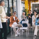 Group,Of,Multiethnic,Colleagues,Smiling,While,Discussing,Business,Strategy,For