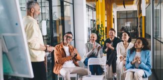 Group,Of,Multiethnic,Colleagues,Smiling,While,Discussing,Business,Strategy,For