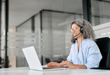 5 Ways to Protect Your Bottom Line in the Age of AI Happy,Senior,Older,Woman,Professional,Call,Contact,Center,Agent,Wearing