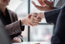 Business,Handshake,For,Teamwork,Of,Business,Merger,And,Acquisition,successful,Negotiate,hand