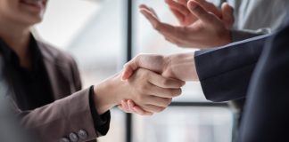 Business,Handshake,For,Teamwork,Of,Business,Merger,And,Acquisition,successful,Negotiate,hand