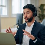 Businessman,,Talking,And,Headset,With,Laptop,In,Office,,Consultant,And