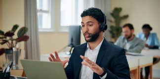 Businessman,,Talking,And,Headset,With,Laptop,In,Office,,Consultant,And