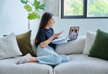 Teenage,Girl,Having,Online,Therapy,Sitting,At,Home,Using,Laptop